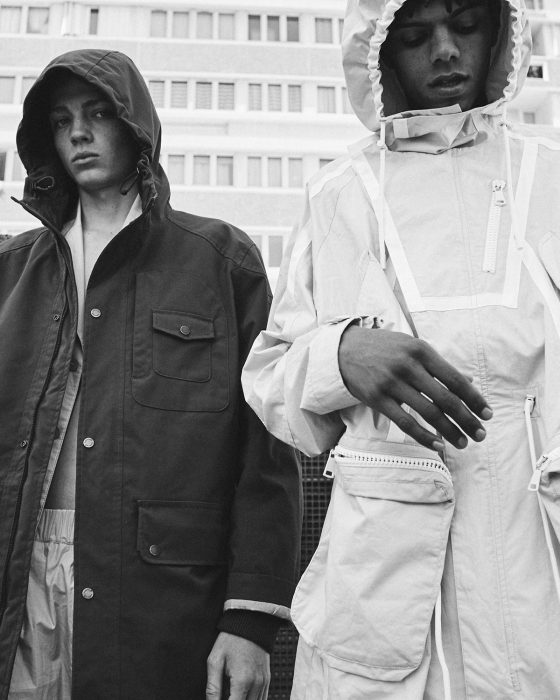 Quentin wears coat hoodie Timberland, pants & jacket Kenzo. Angy wears parka jacket & trousers Kenzo, shoes Sankuanz.