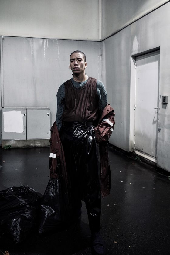 Raincoat, tanktop, cardigan worn underneath LANVIN trousers & shoes ACNE STUDIOS