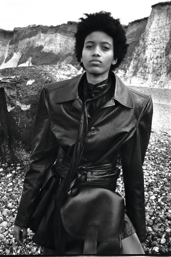 Coat & boots by Balenciaga, shirt by Dries Van Noten, belt with oversized pockets by Marni.