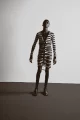 Cardigan by COMME DES GARÇONS from 20AGE ARCHIVE Briefs by JEAN PAUL GAULTIER from 20AGE ARCHIVE Socks by MAISON MARGIELA Shoes by VIVIENNE WESTWOOD