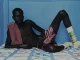 Top (worn on the shoulder) & short by TOM FORD, bracelet by HERMES, socks by VIVIENNE WESTWOOD