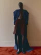 Oversized coat by BALENCIAGA, shorts by DRIES VAN NOTEN, socks by FALKE, shoes by LOUIS VUITTON