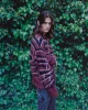 Enzo wears pullover by CAMPERLAB, trousers LOUIS VUITTON