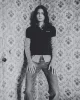 Enzo wears polo & shirt by MIU MIU, jeans by CELINE BY HEDI SILIMANE
