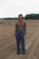 Nima wears top & trousers by LOEWE, vintage shoes