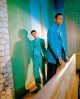 Ali wears all clothes by Comme des Garçons Homme Plus, Romaine wears jacket by Études, turtleneck & trousers by Prada