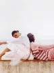 Annibelis wears all clothes by Simone Rocha 4 Moncler. Khadim wears sleeveless sweater by Lanvin, shirt & trousers by Ludovic de Saint Sernin
