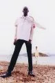 Khadim wears shirt worn on top by Y/Project, shirt & trousers by Givenchy, shoes by Balenciaga. Annibelis wears all clothes by Thom Browne