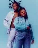 Brian wears jacket & trousers by Louis Vuitton, jewellery from model’s archive. Lauryn wears jacket & trousers by Stella McCartney, jewellery from stylist’s archive