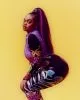 Lauryn wears jumpsuit by Versace Jeans Couture, shirt by Berluti, jewellery from stylist’s archive