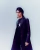 Angus wears coat, trousers & necklace by MM6 Maison Margiela, top by Aries, hat by Kangol