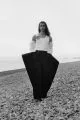 Tank top & sleeves by Ann Demeulemeester, trousers by JW Anderson, broach by The Contemporary Wardrobe, boots by Saint Laurent by Anthony Vaccarello