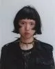 Jacket & top by Saint Laurent by Anthony Vaccarello, necklace by Slim Barett, earrings archive