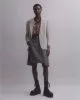 Blazer by Goldsmiths Vintage, vest by Contemporary Wardrobe, shorts by Dries Van Noten, belt by Celine Homme, boots by Underground, earring by Slim Barrett