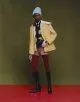 Jacket & shorts by Jacquemus, sweater by Namacheko, shirt & tie by GmbH, hat by Acne Studios, earring by Louis Vuitton, necklace by Saboteur, gloves by Ernest W. Baker, tights by Falke, boots by Saint Laurent by Anthony Vaccarello